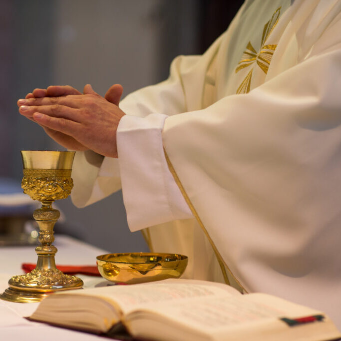 Priest during a wedding ceremony/nuptial mass Priest during a wedding ceremony/nuptial mass